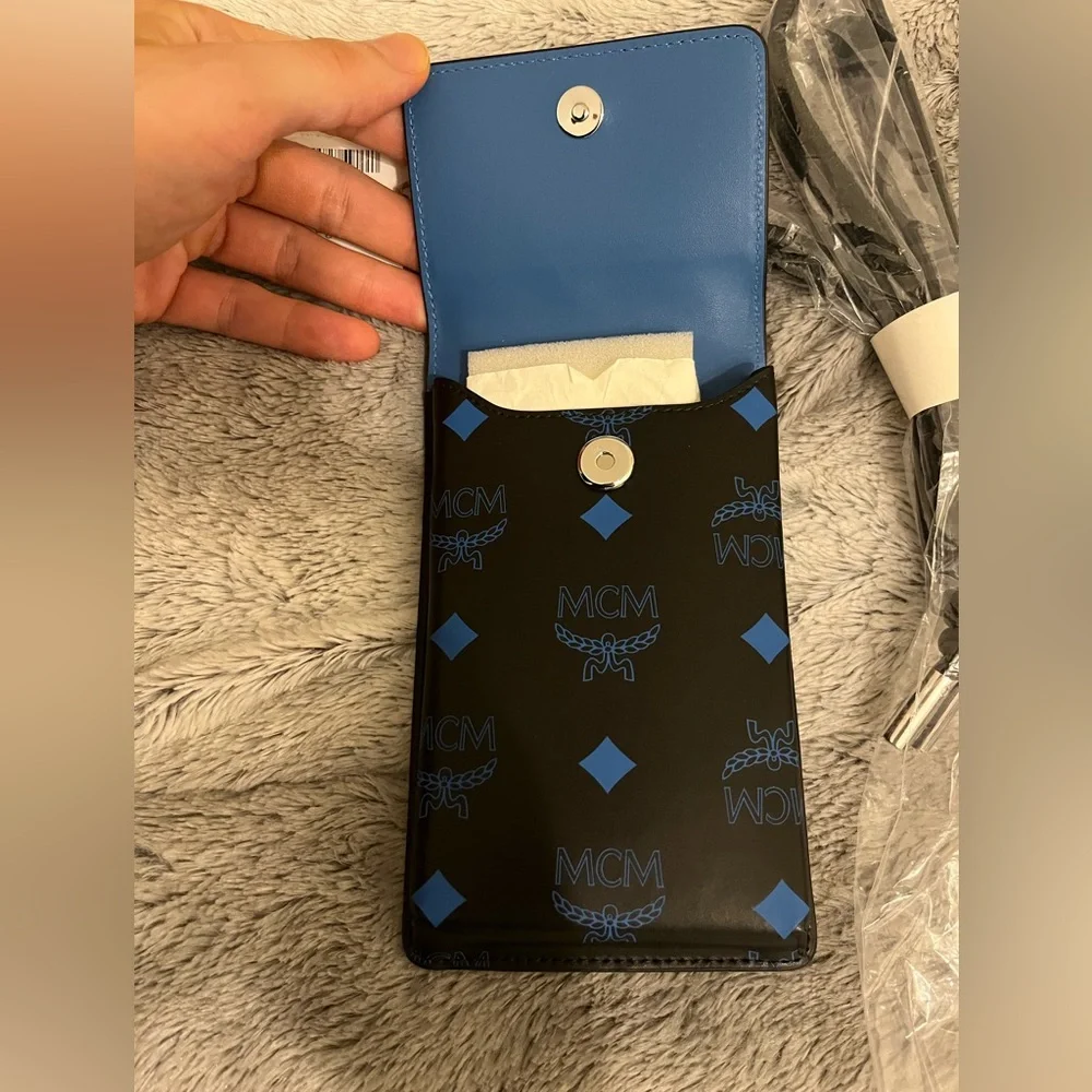 NEW NWT MCM LOGO PHONE LANYARD VALLARTA BLUE BLACK AUTHENTIC INCL SAKS TAG